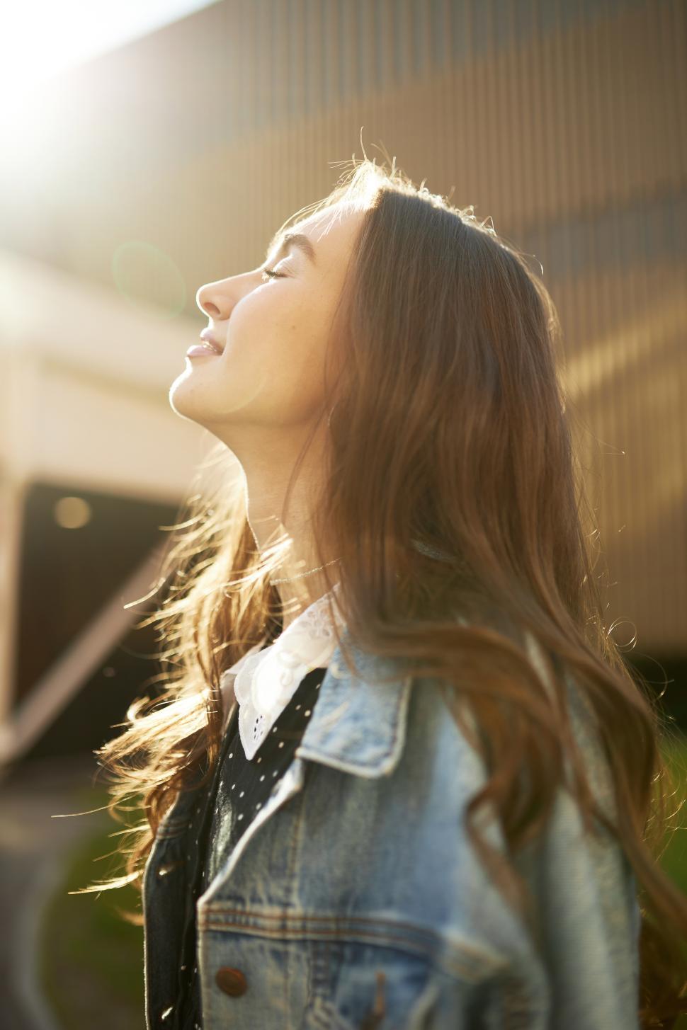files/side-view-of-beautiful-charming-caucasian-girl-of-20s-with-long-hair-in-denim-jacket-enjoying-warm-spring-day-turning-her-face-to-sun-with-closed-eyes-during-her-summer-stroll-around.jpg